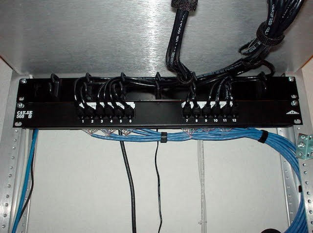 Short patch cables up to the switch. The aluminum is the bottom of the shelf that the switch sits on