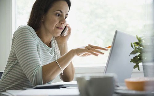woman-using-tech-at-home_featured