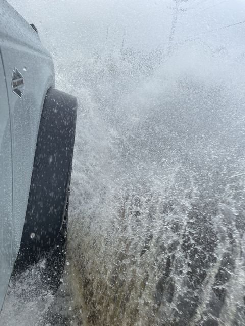 Living With The New Ford Bronco 5 bronco front tire splashing a puddle
