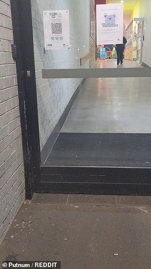 The code, placed on a sliding door entrance of Coles Croydon in Sydney's inner west is unable to be used when the automatic doors open