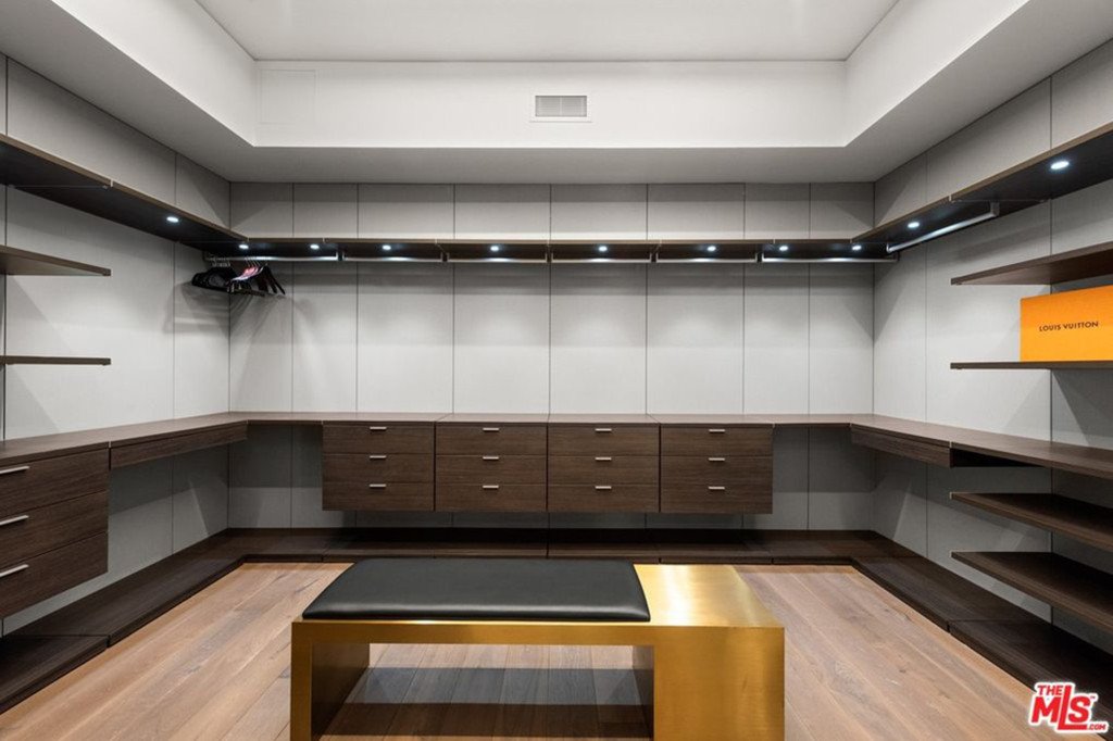 A walk-in closet is pictured. 