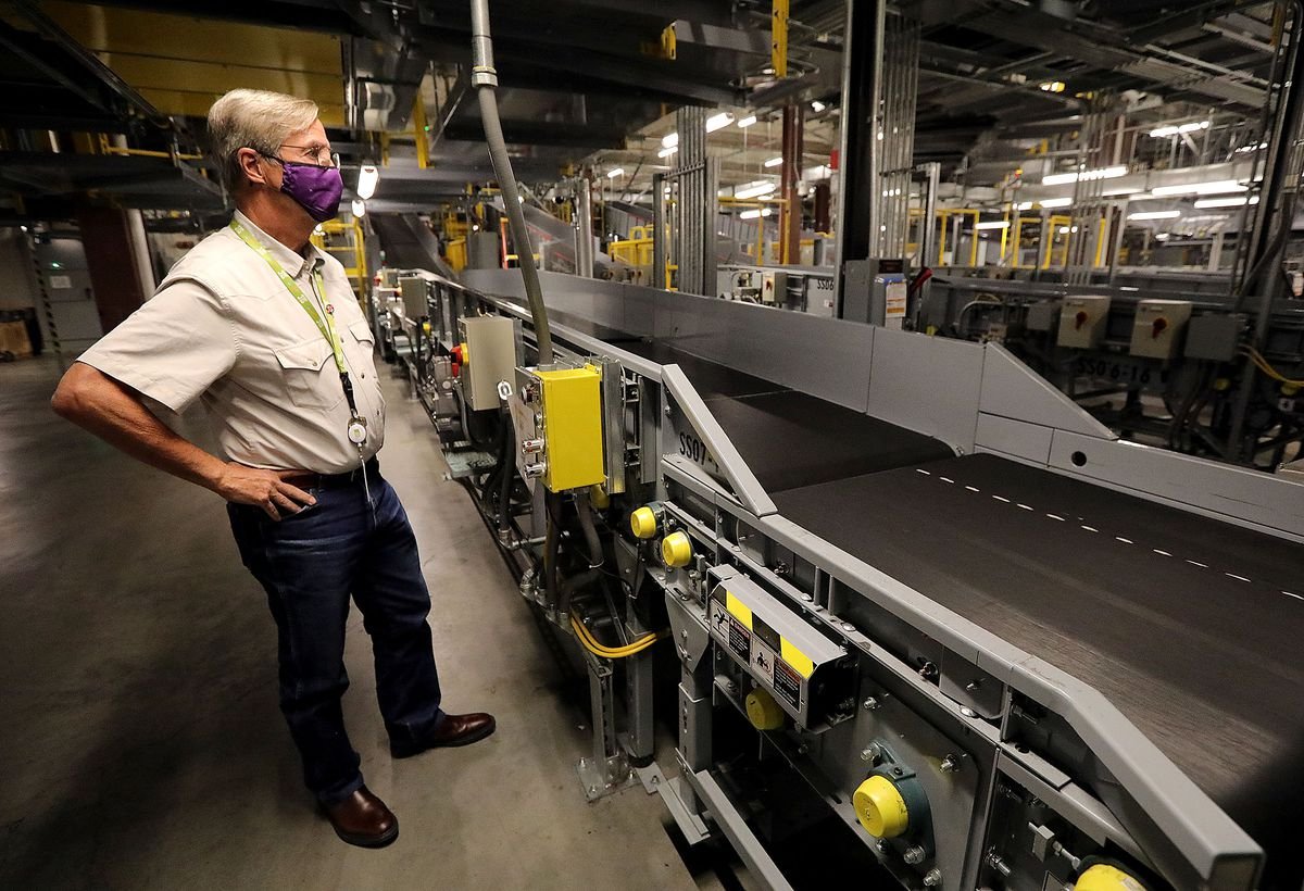 The day that changed air travel forever 2 Bill Wyatt, director of the Salt Lake City International Airport , gives a tour of the room where checked luggage is scanned at the airport in Salt Lake City on Thursday, Aug. 26, 2021.