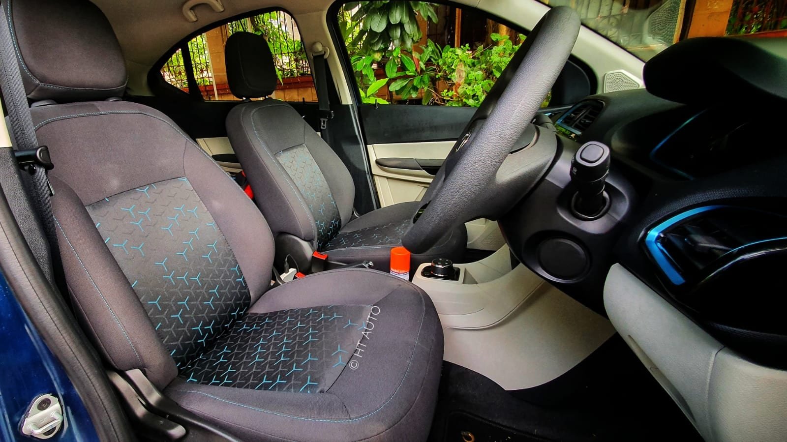 Blue accents on the air vents as well as blue stitching on the seats underline the EV credentials of Tigor EV. Blue accents on the air vents as well as blue stitching on the seats underline the EV credentials of Tigor EV.